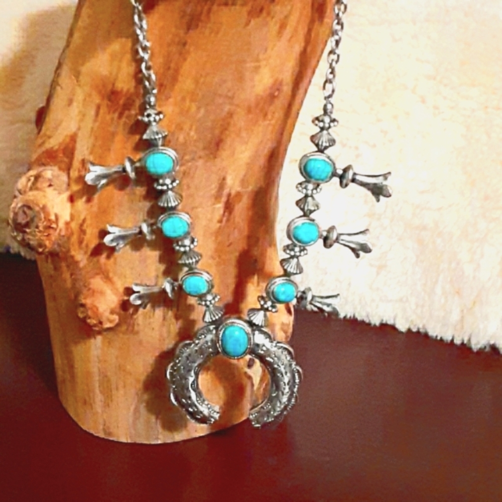 Faux turquoise and silver tone necklace.